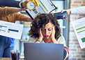 Office worker surrounded by people demanding her attention, looking super anxious