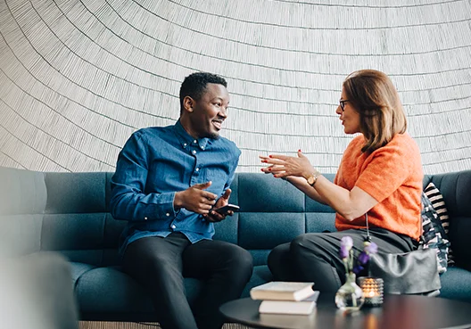 Man chatting with woman