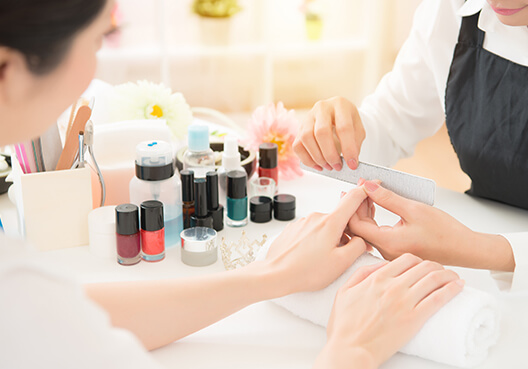 A customer gets her nails done at a local beauty salon. 