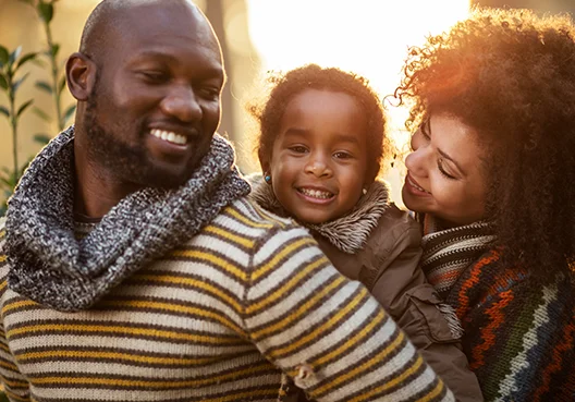A South African couple spend time with their young child. 