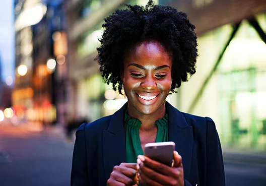 Woman smiling at her phone
