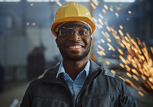 An engineer wearing yellow safety equipment at a construction site. 