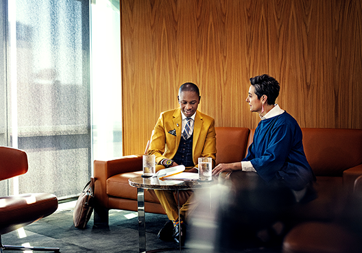 two people in a boardroom
