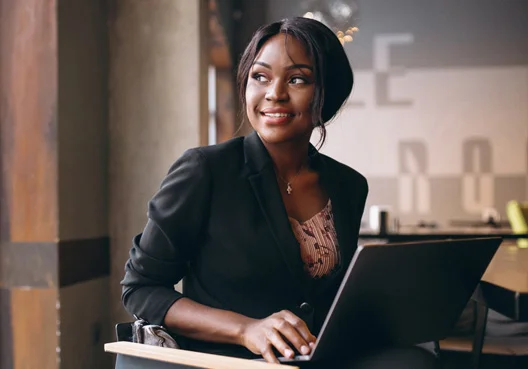 A female professional does research on investing for retirement. 