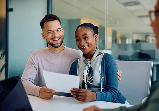A person uses a free online tool on a PC to work out their credit score.