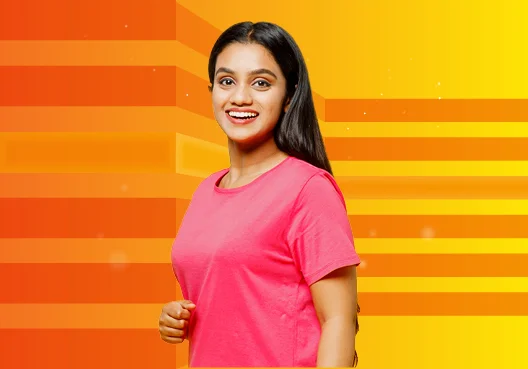 A young woman applying for a bursary smiles. A young woman wearing a pink short sleeved t-shirt smiles.