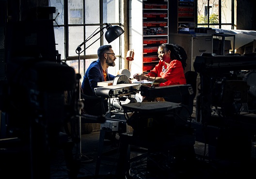 a group of people with open notebooks