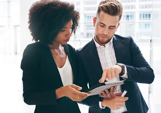 Business people looking at a tablet
