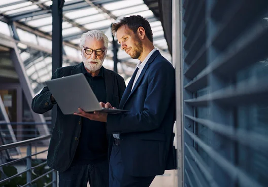 People seen in glass building