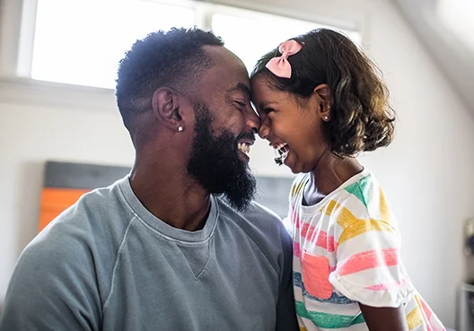 A South African man spends time with his daughter at home.