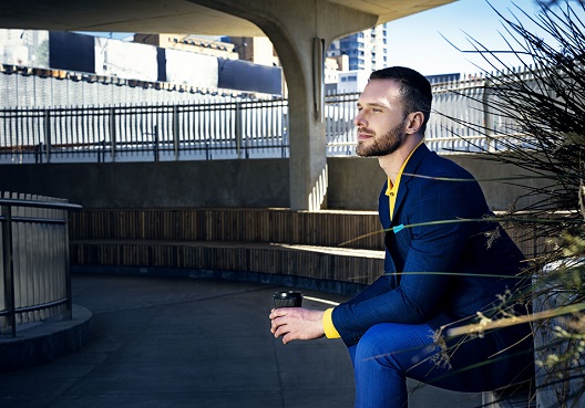 woman walking down the stairs with a pink umbrella