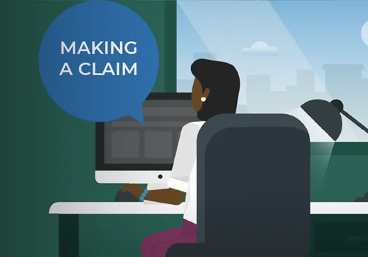 A woman uses a computer to go online and submit a claim for her short-term insurance policy.