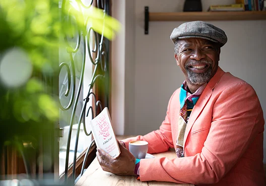 Lady in colourful wear smiles