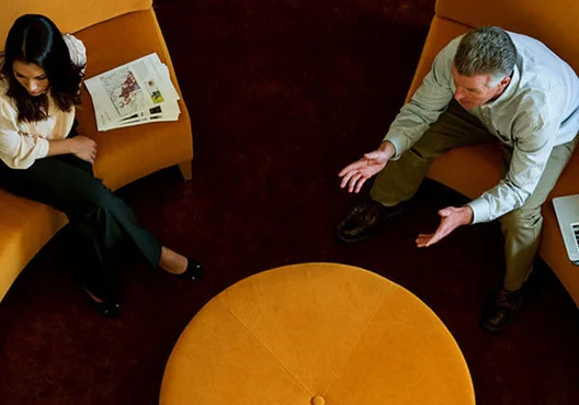 A company representative attends a presentation on Smoothed Bonus Funds. 