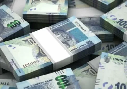 Wads of South African hundred rand notes.