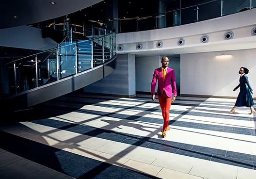 Man in colourful wear seen walking