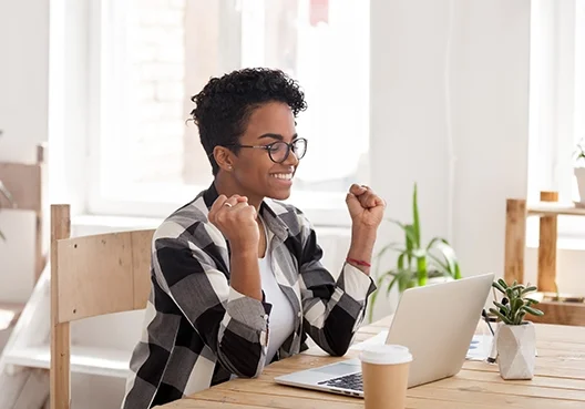 Young woman excited at seeing how many rewards points she has
