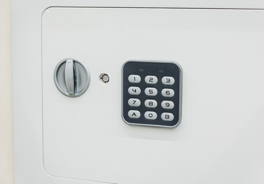 A keypad on a safe containing money belonging to a business.