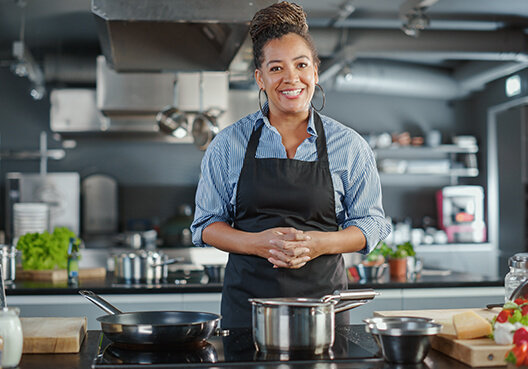 A restaurant entrepreneur in her busy kitchen.