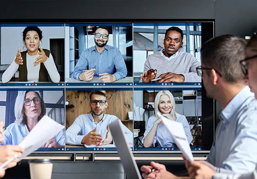 Employers from different companies attend the same meeting online. 
