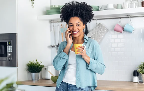 A woman chats to a property finance consultant after starting a home loan application. 